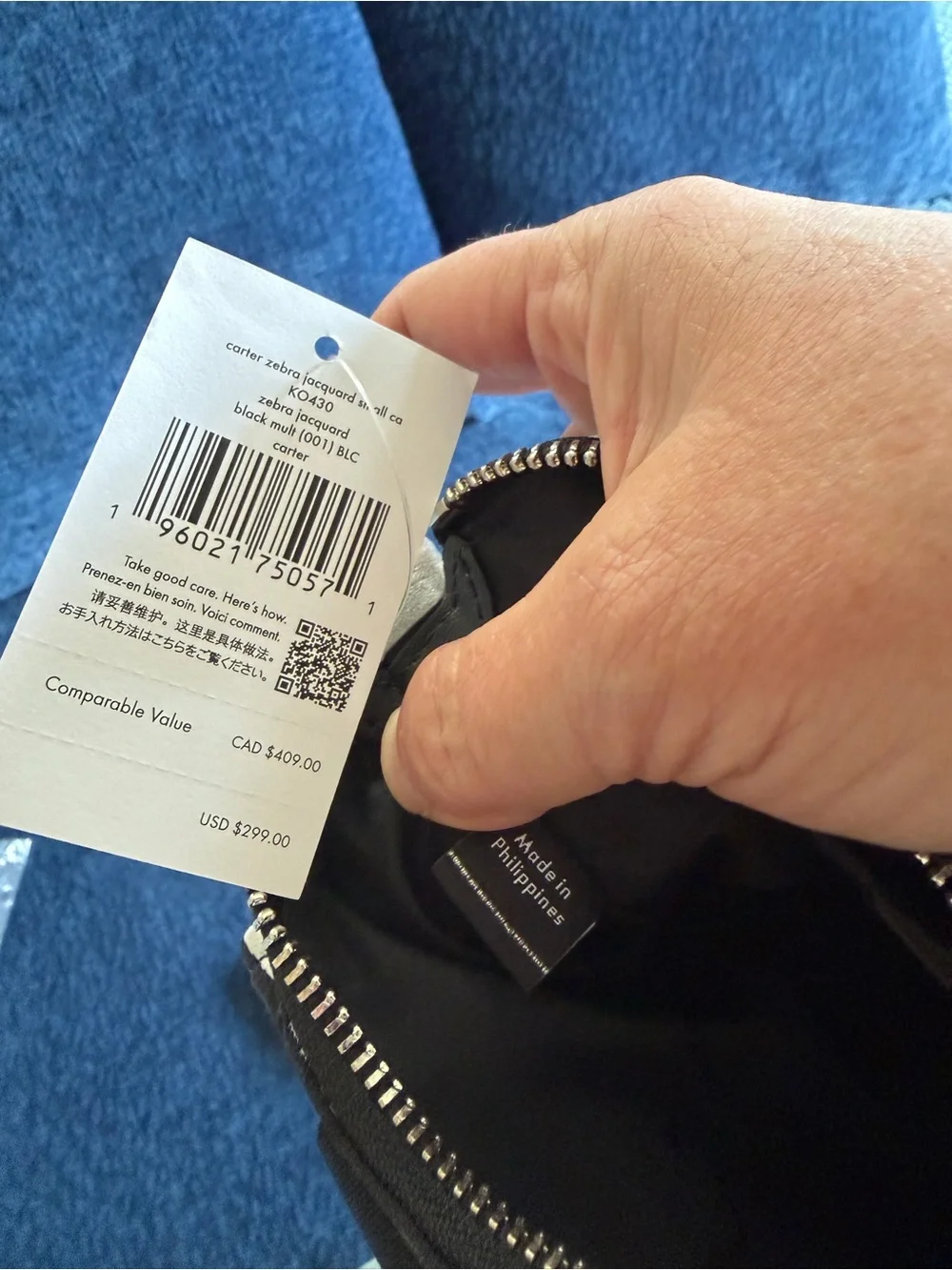 Kate Spade Carter Zebra Cargo Crossbody Bag in black and white